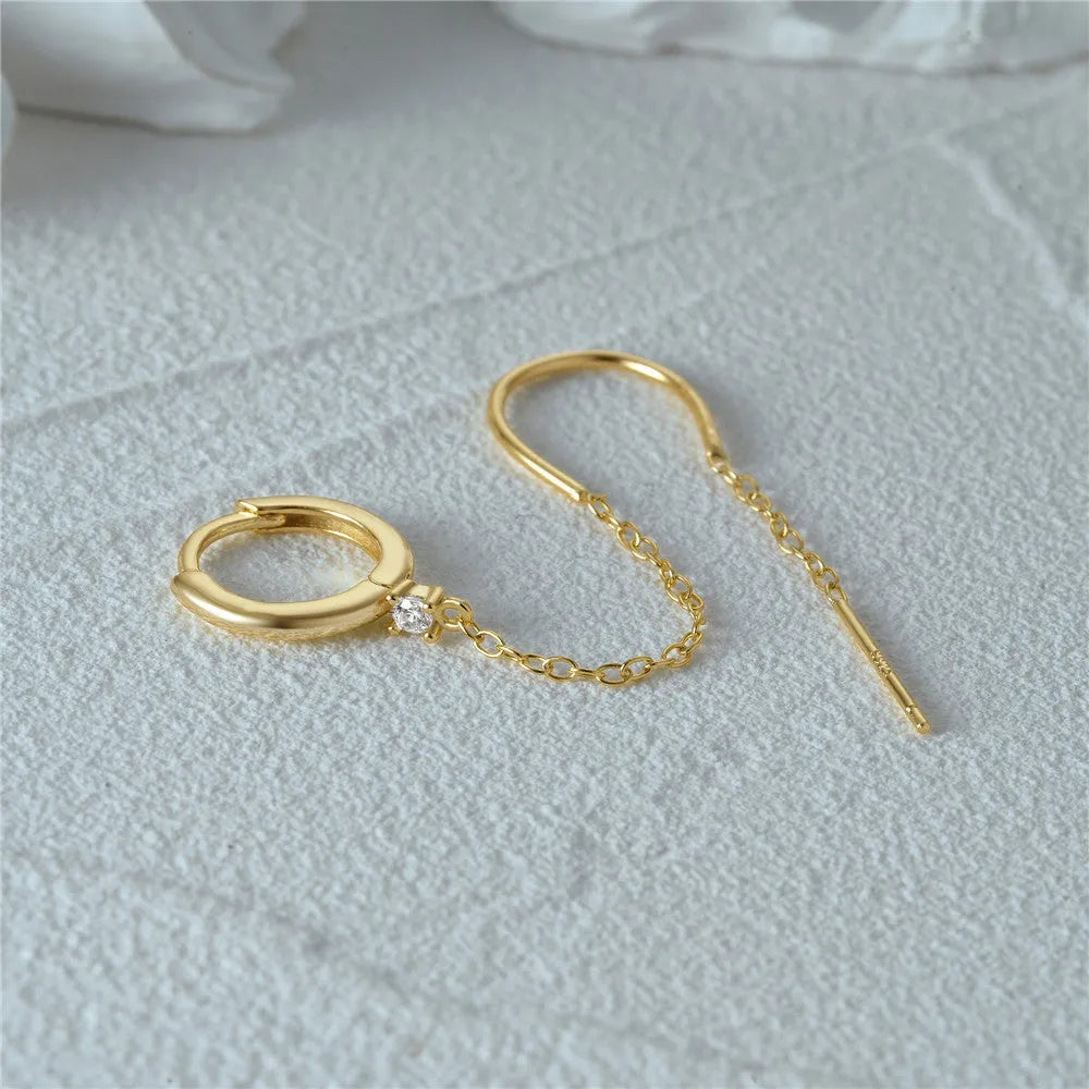 S925 sterling silver ear studs with a diamond flower, tassel, and chain design in a golden electroplated finish.