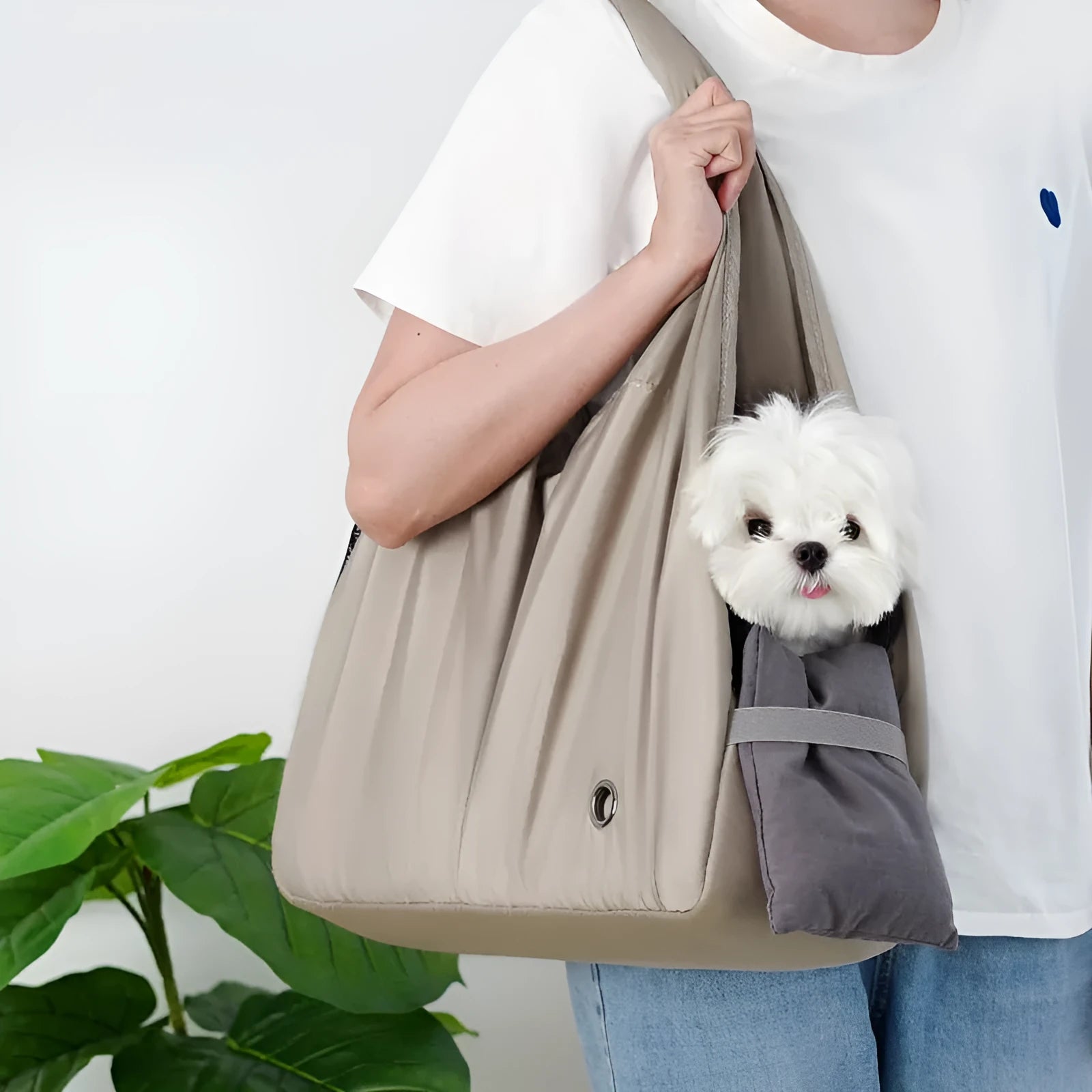 Apricot-coloured cloth pet carrier handbag for outdoor use with small pets.