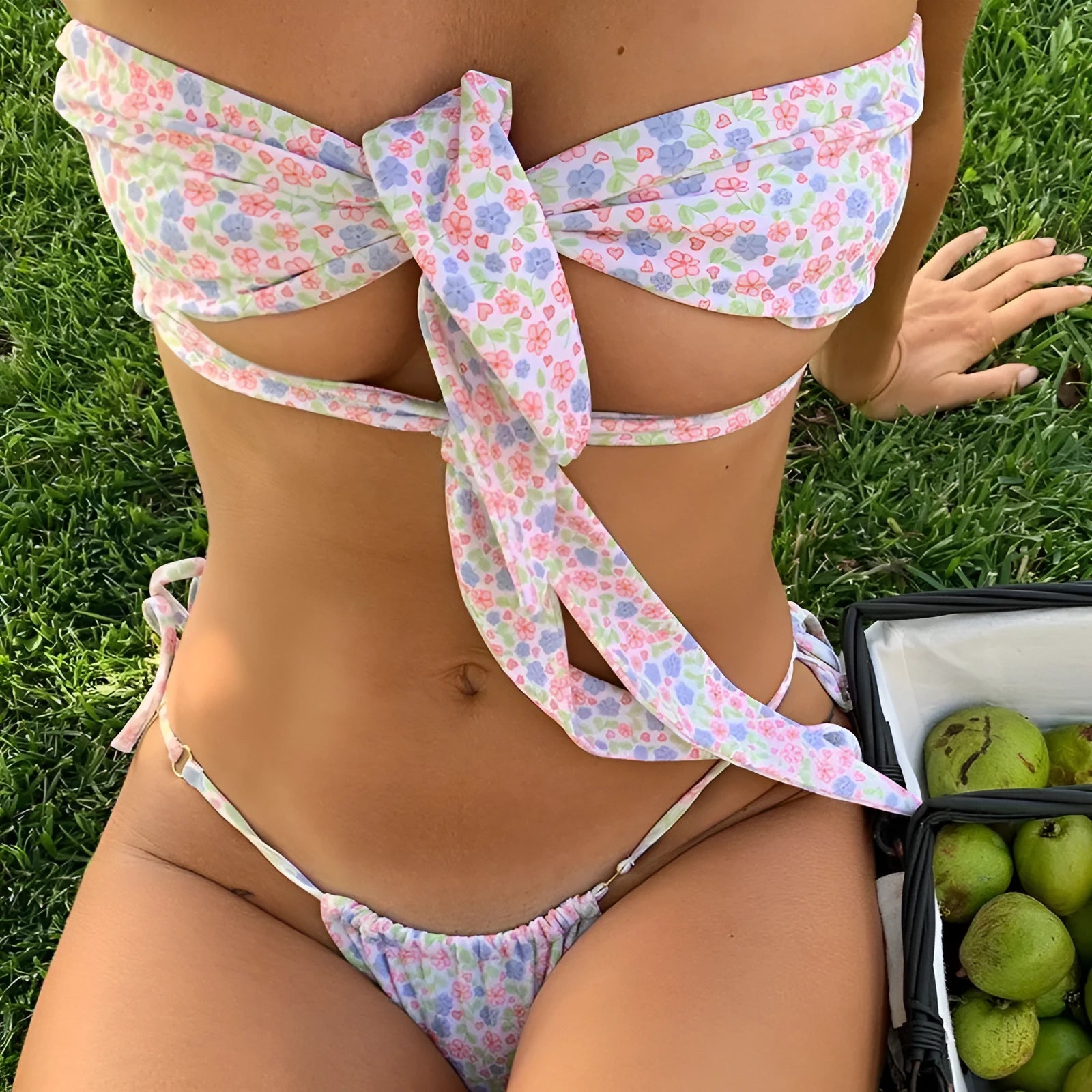 Women's lace-up front swimsuit with floral pattern and integrated chest pad