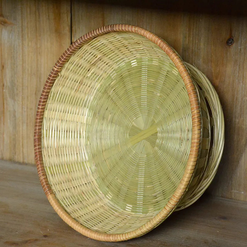 Handmade natural bamboo storage basket shown in one of three size variations for household organisation.