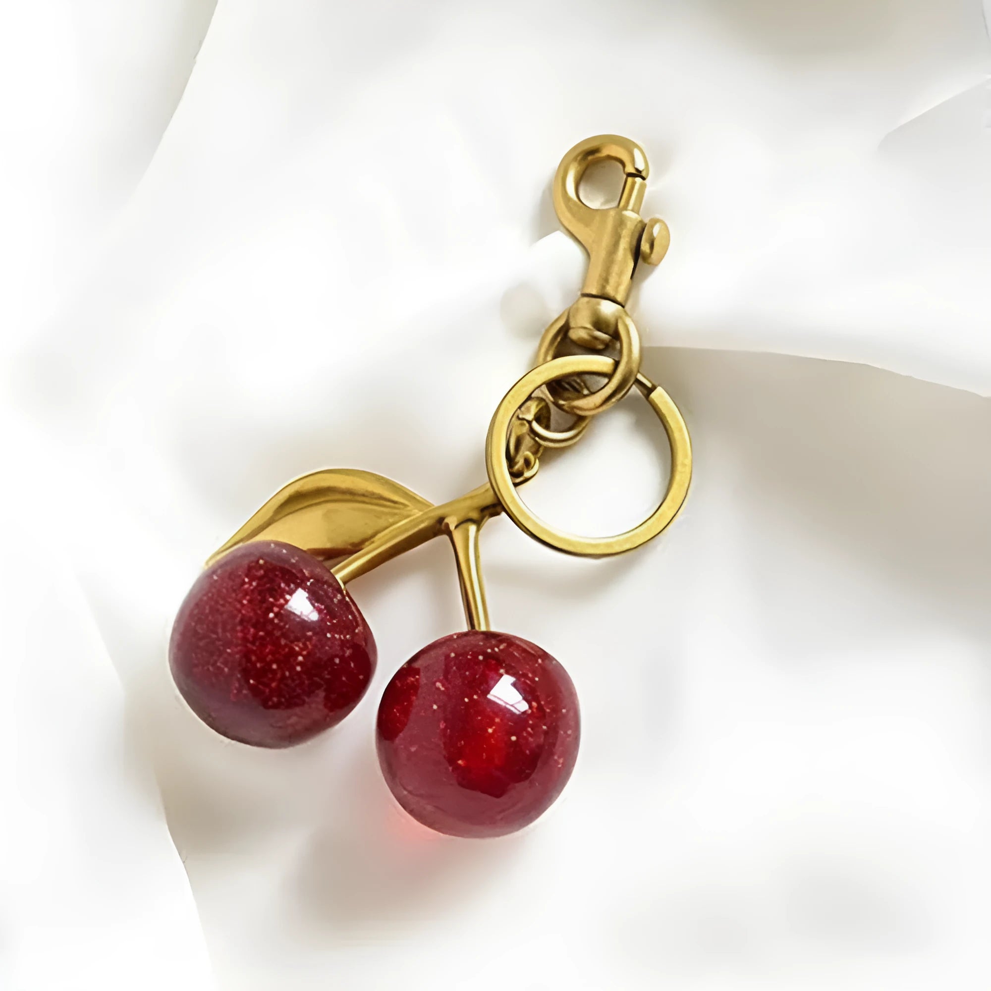 Zinc alloy cherry blossom keychain pendant in pink or red colour with three-dimensional design
