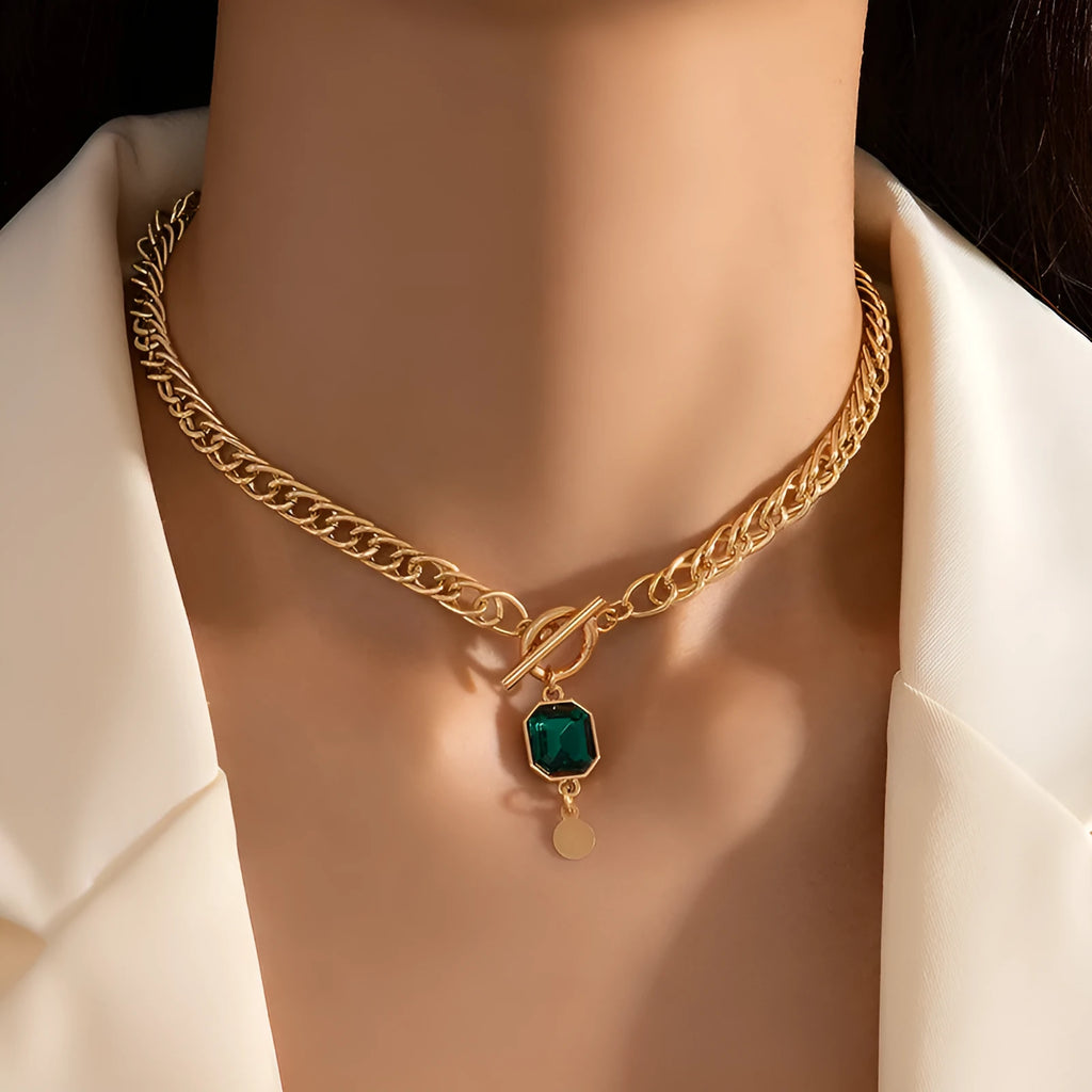 Gold geometric round zircon pendant necklace on a titanium steel Cuban link chain.