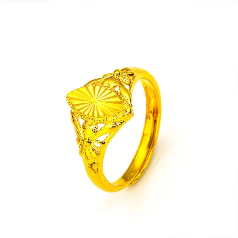 Gold-coloured brass flower ring with geometric texture and open diamond shape design