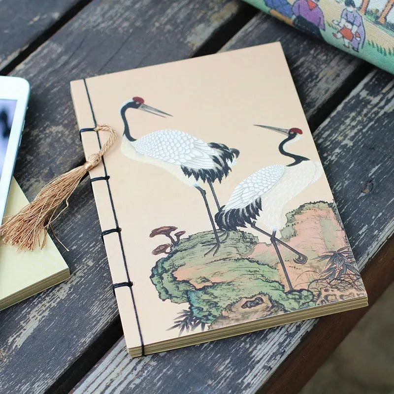 A5 antique thread-bound notebook with embossed cover and decorative tassels