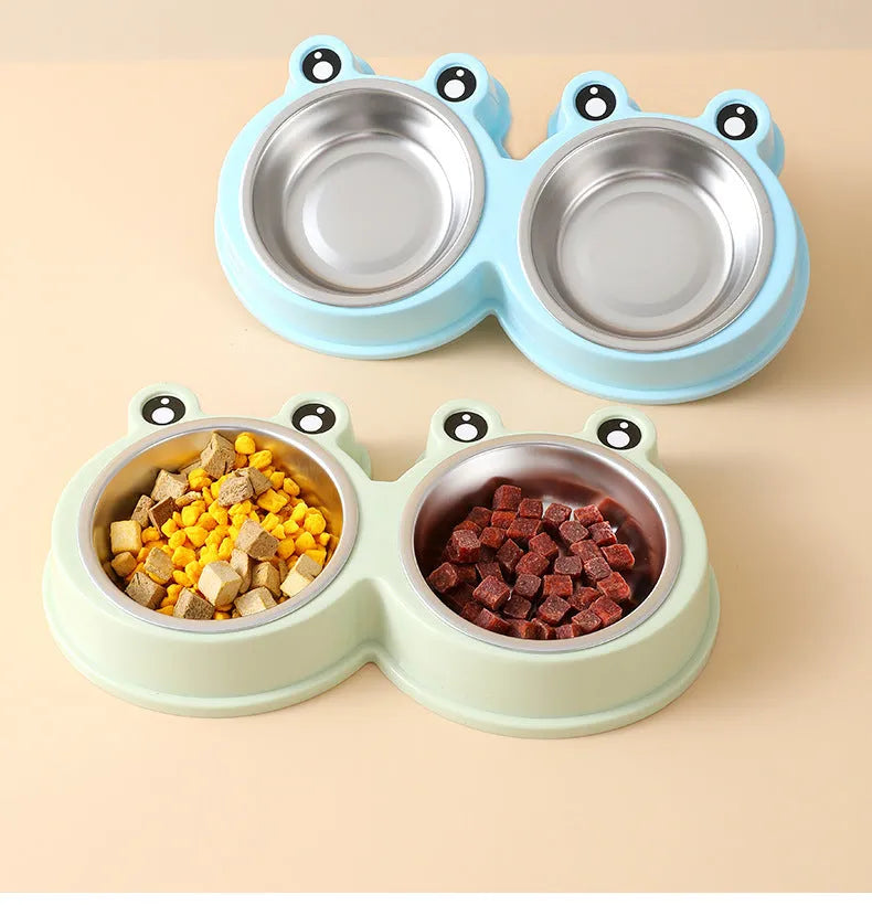 Stainless steel frog-shaped double pet bowl for food and water, available in blue, green, or pink.