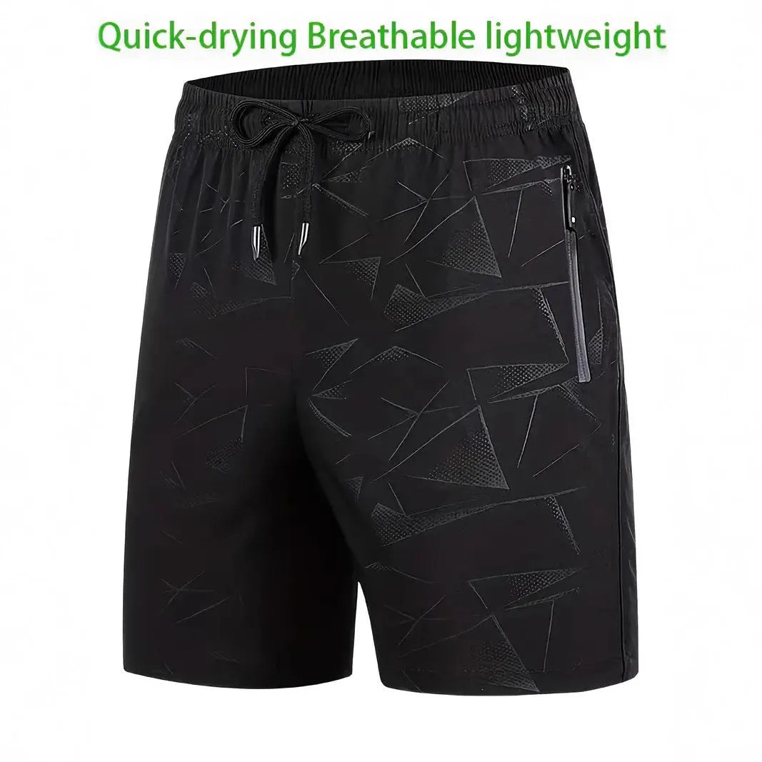Man wearing loose black polyester sports shorts with an elastic waistband, suitable for gym or casual wear.