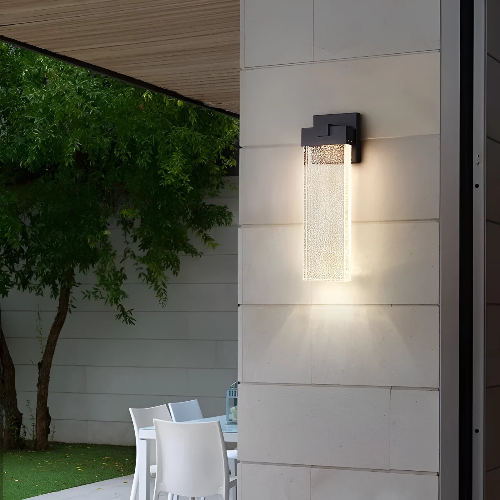 Black outdoor LED wall lamp in stainless steel with warm light for courtyards and corridors