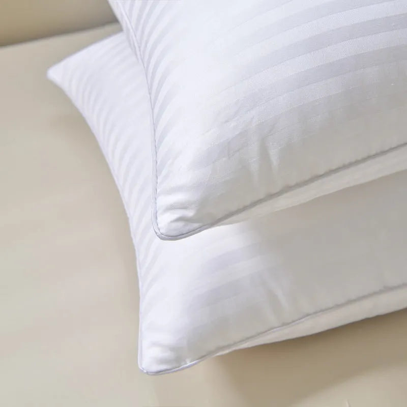 White cotton satin stripe pillow with feather filling in three size options for hotel or home use