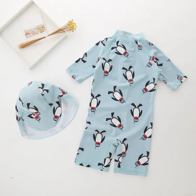 Boys' penguin print polyester swimsuit set with matching swimming cap for sun protection