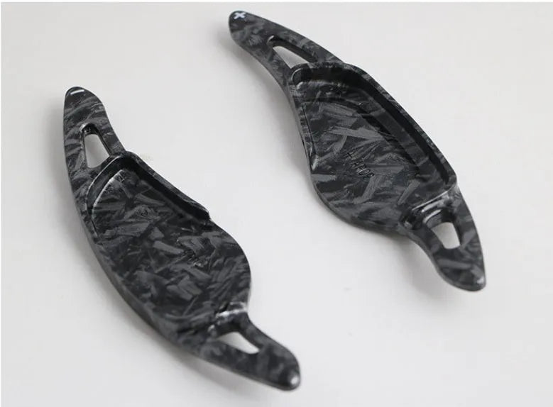 Carbon fibre pattern steering wheel paddle shift modification kit for car interior.