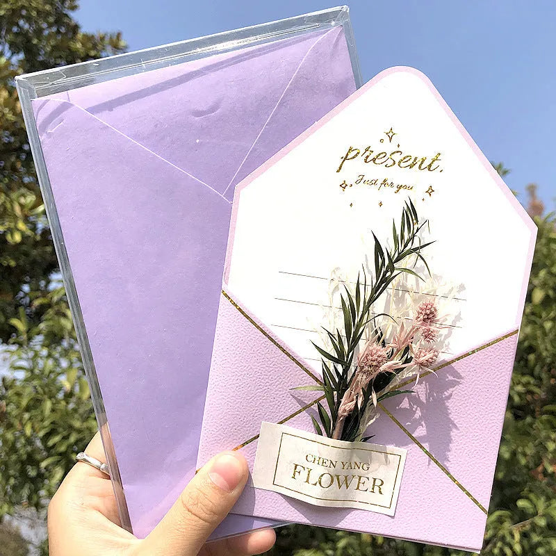 Handmade 3D boxed greeting card with butterfly shape, hot stamping, and artificial flowers on coated paper.