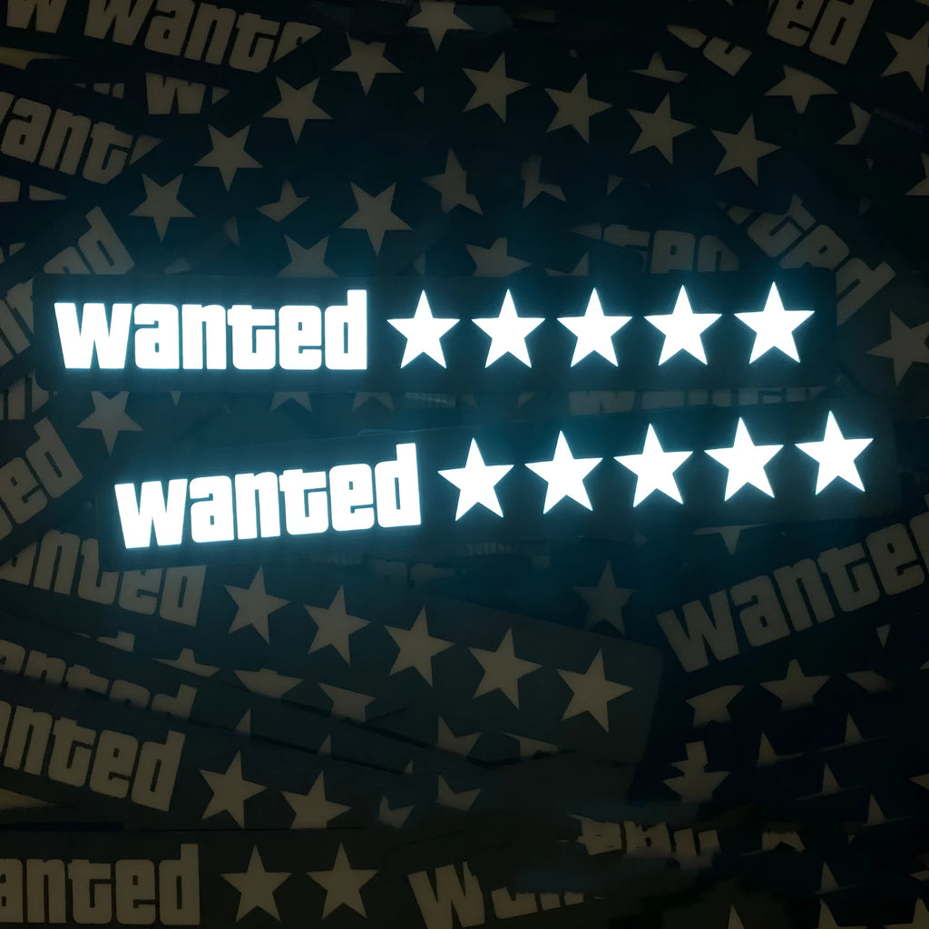 Car luminous sticker with white EL light glow, 27x4cm, showing Wanted text on a black interior surface