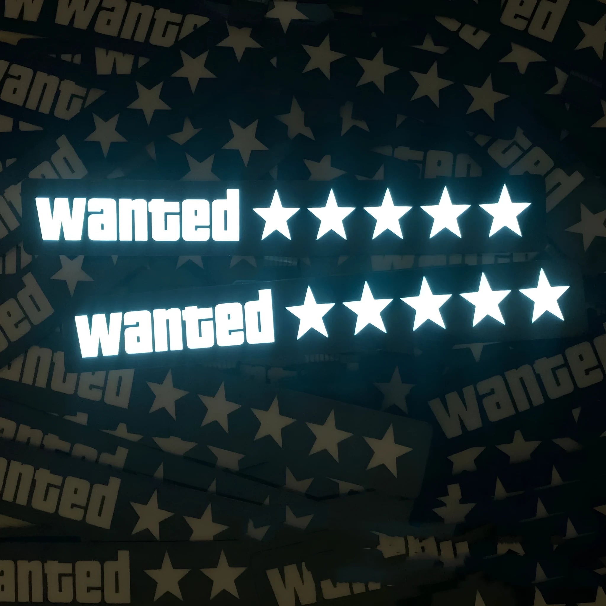 Car luminous sticker with white EL light glow, 27x4cm, showing Wanted text on a black interior surface
