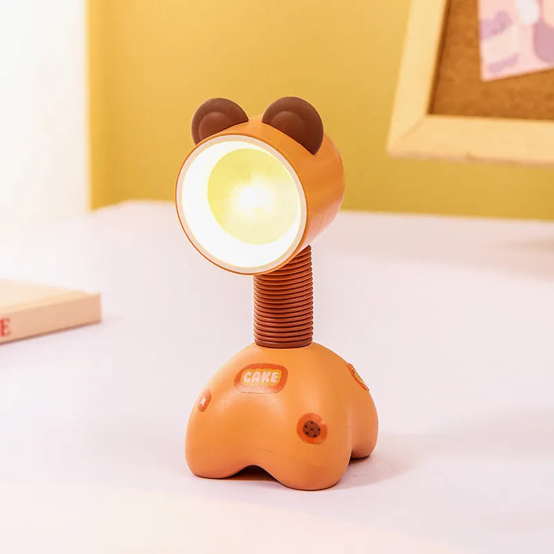 DIY cartoon magnetic small night lamp in assorted animal styles and colours on a desktop.