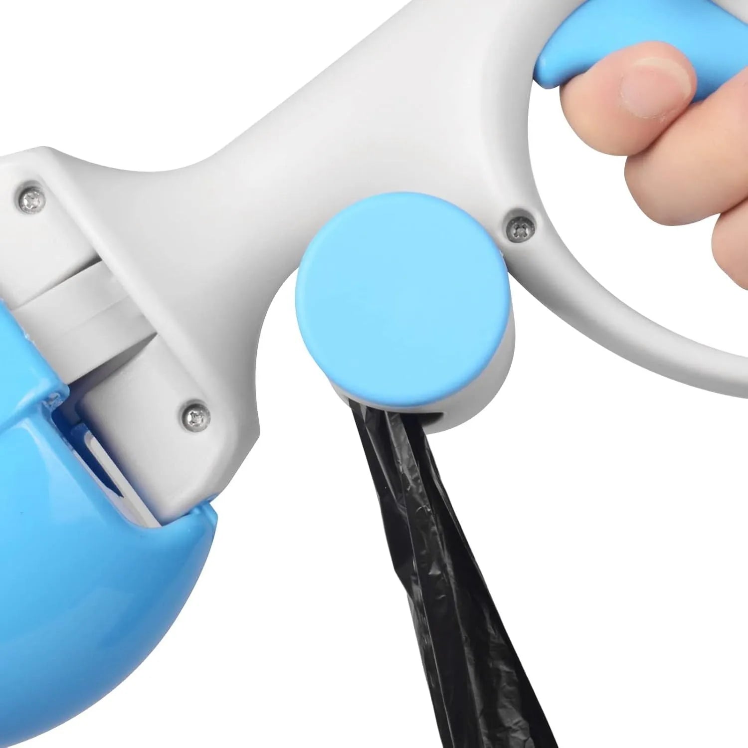 Black pet pooper scooper with built-in trash bag holder and carrying hook on a gravel path.