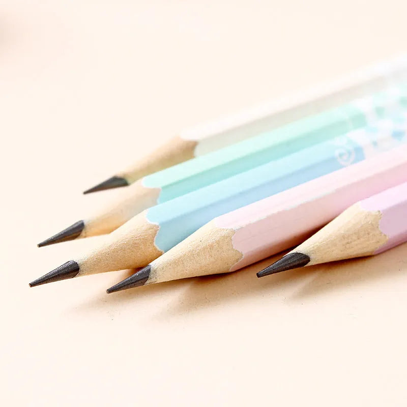 Barrel of 50 basswood six-angle thermal transfer pencils with HB refills on a work surface.