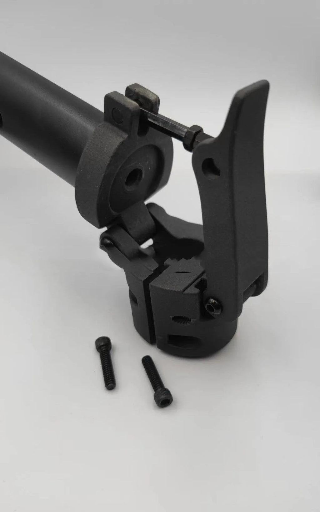 Black metal folding upright pole accessory for a Nanbo No. 9 electric scooter.