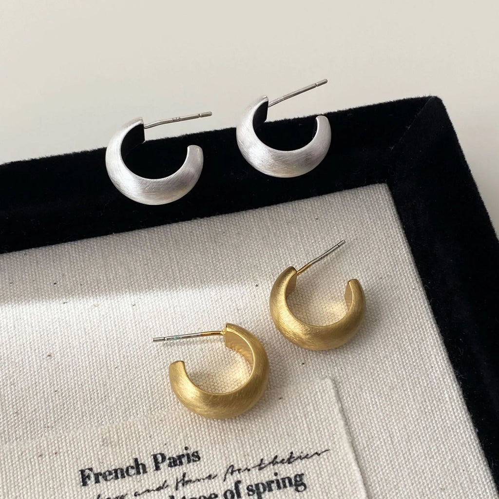 Geometric C-shaped brushed copper earrings with frosted finish available in gold or silver for women