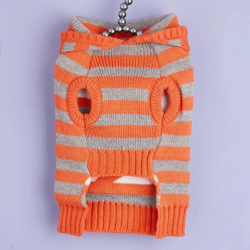 Orange Halloween pet sweater with striped pattern, fur ball decorations, and a hood for dogs or cats.