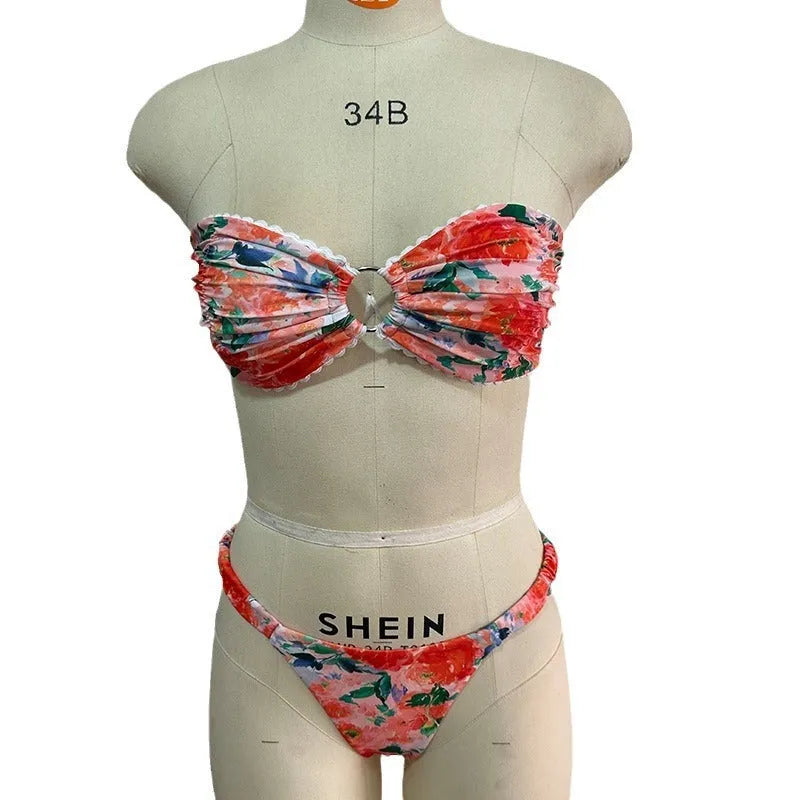 A colourful floral print lace tube top bikini set with matching shorts on a mannequin.