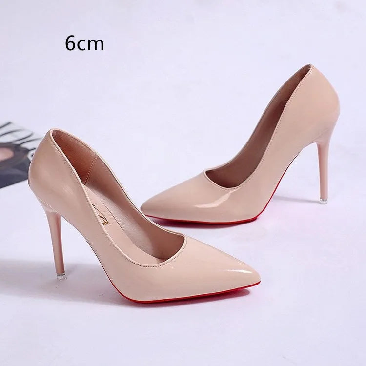 Women's black stiletto heel pumps with pointed toe and shallow mouth design on white background